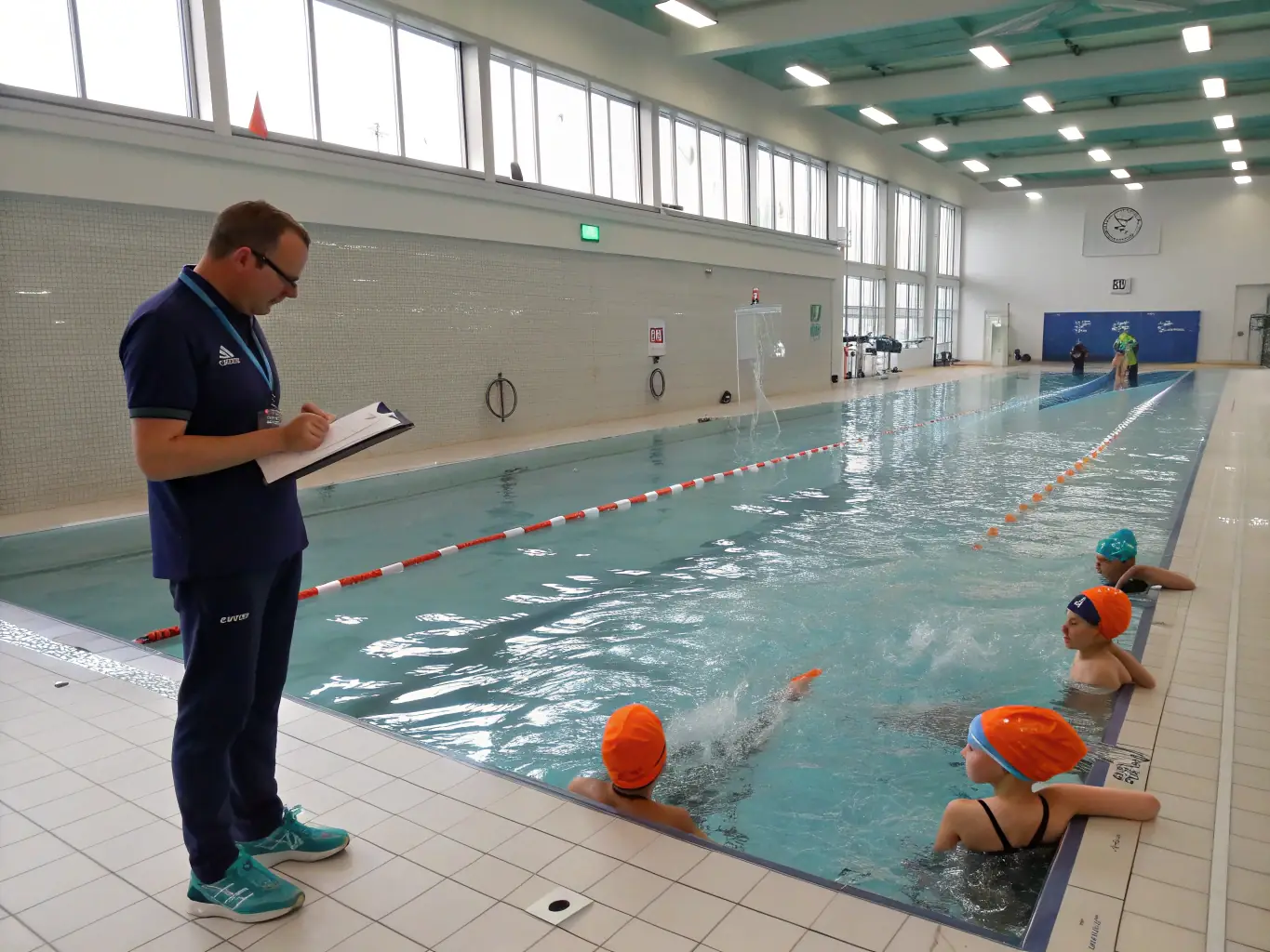 An image of coaches providing guidance and support to athletes during a swin training session, emphasizing the importance of mentorship.